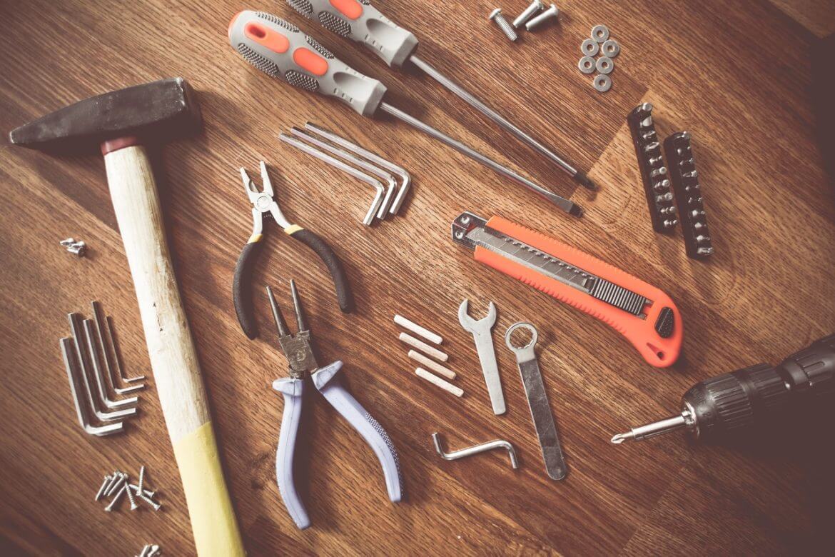 tools are laid out on a wooden table