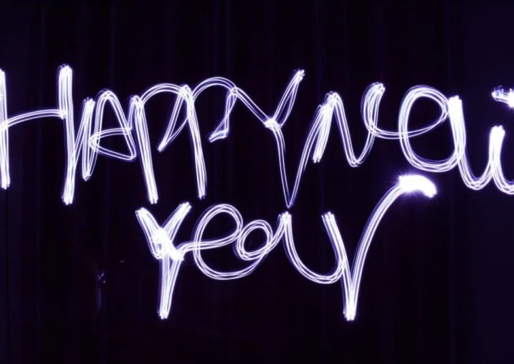 a neon sign that says happy new year