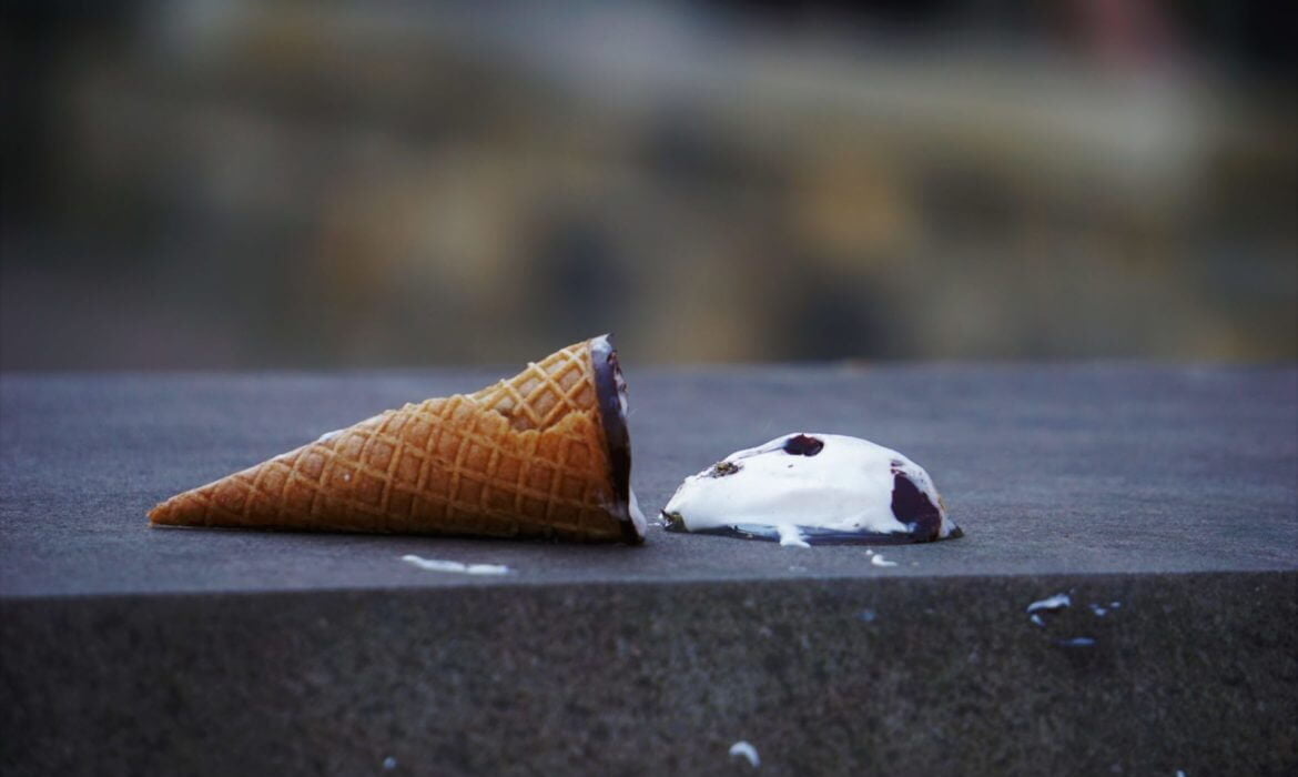 an ice cream cone with chocolate chips on it